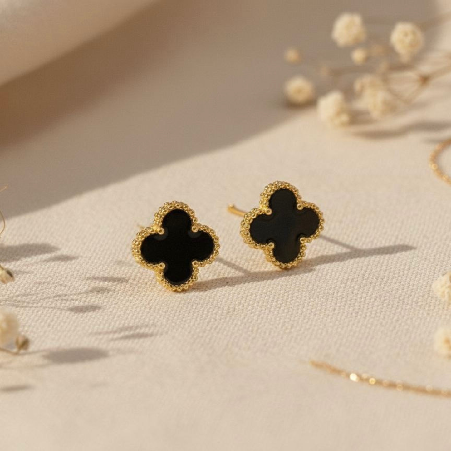 Black fortune leaf studs
