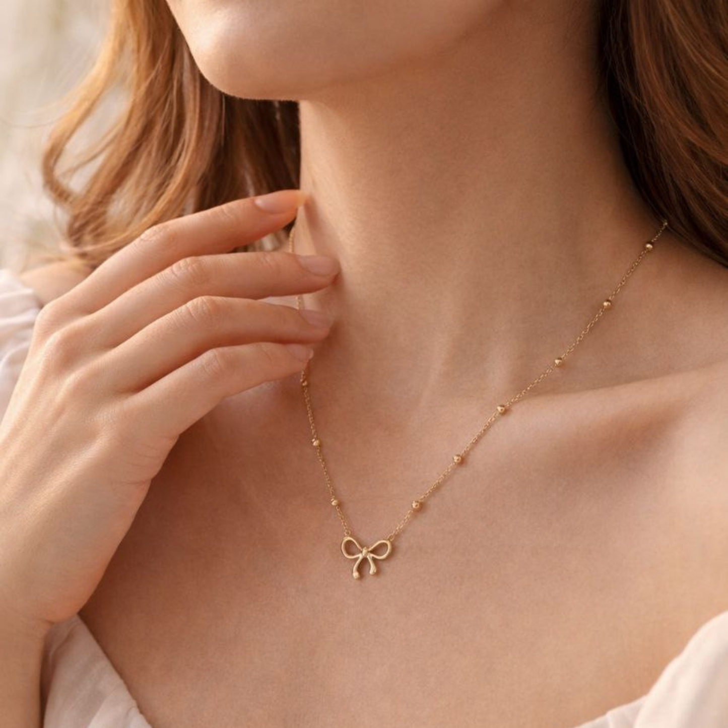 Golden Bow Whisper Necklace